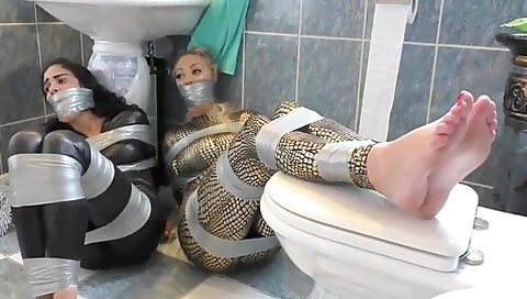 Two Girls In Catsuit Duct Taped And Gagged
